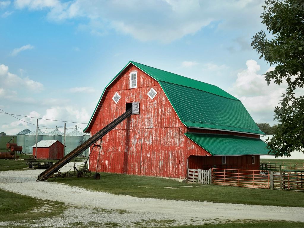 Red barn with a green roof on an Amish farm